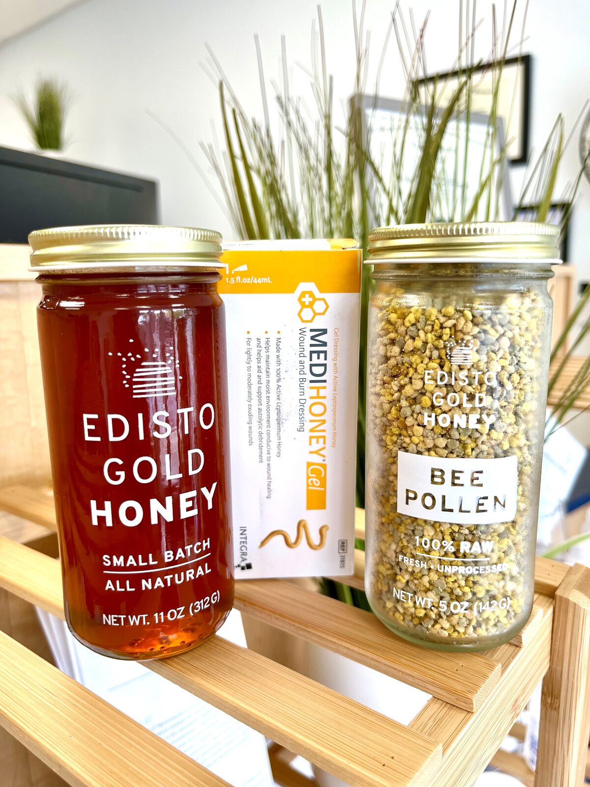 Local small-batch honey and bee pollen jars on a shelf in the store
